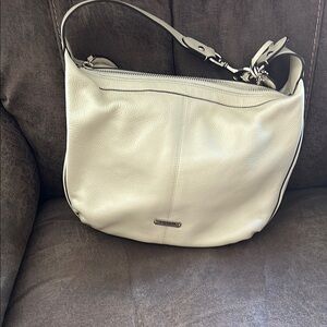 Coach, elegant Cream Leather Shoulder Bag with tassel and tag 9 1/2 x 11 1/2